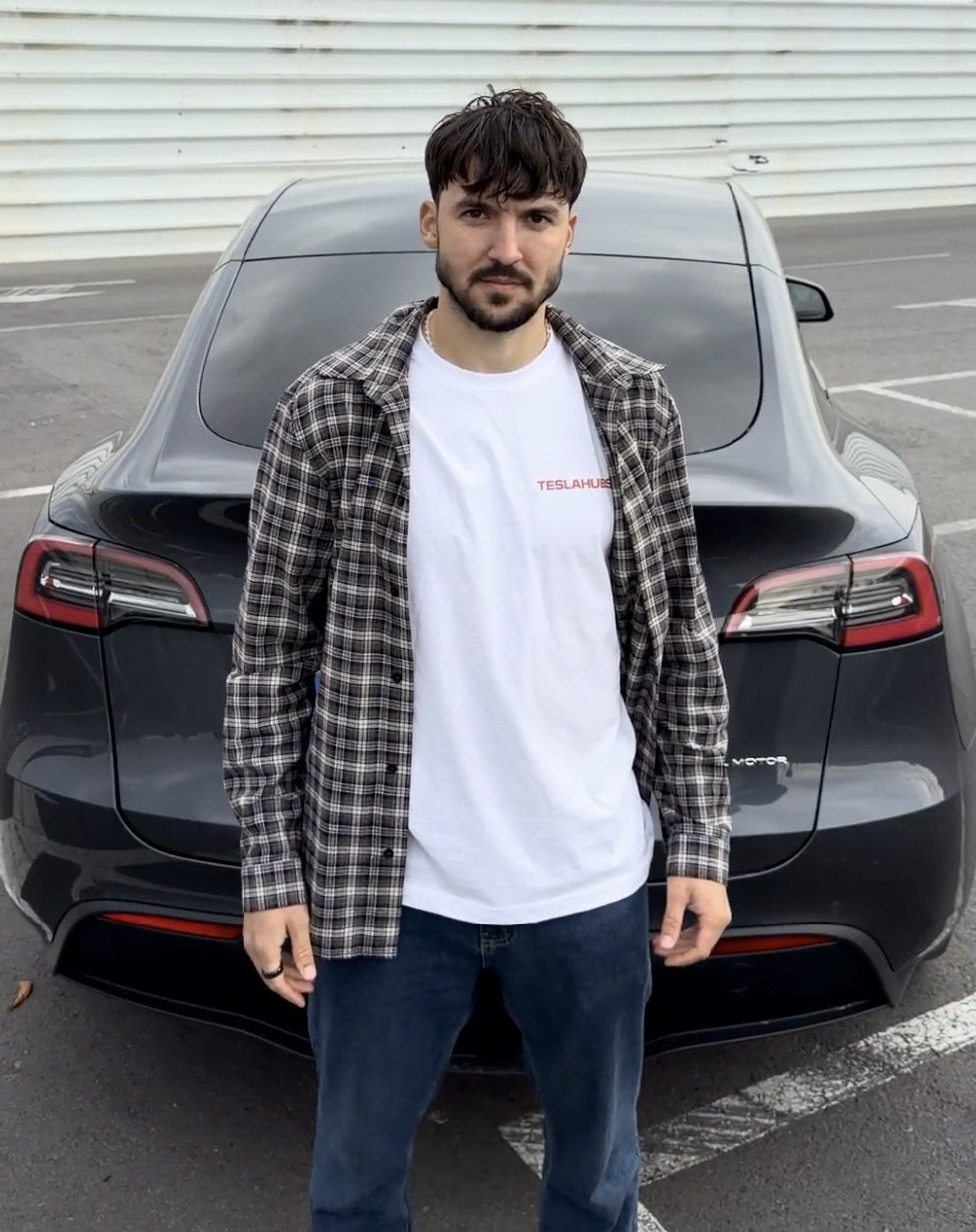 TeslaHubs team member standing in front of a Tesla Model Y