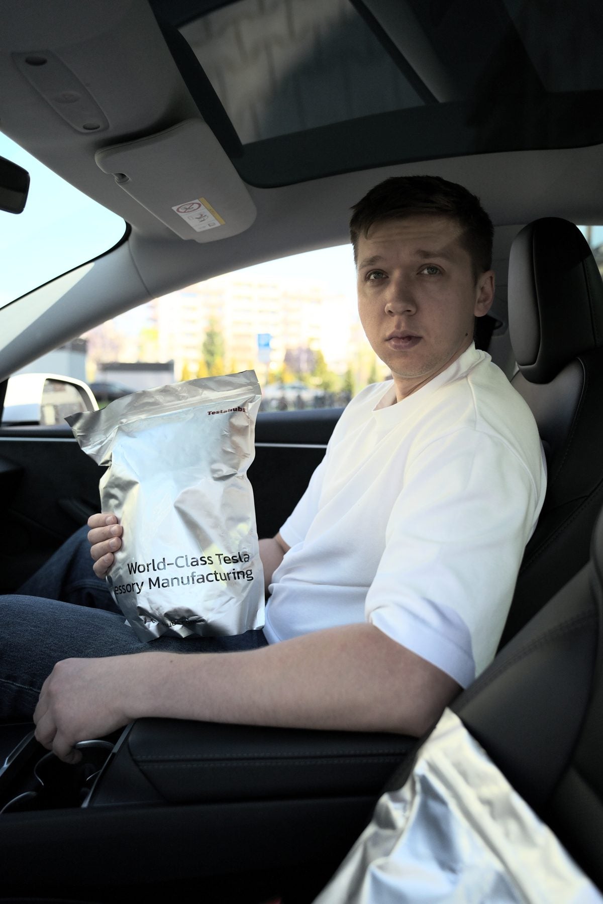 TeslaHubs team member in a Tesla fitting a ProGuard seal kit