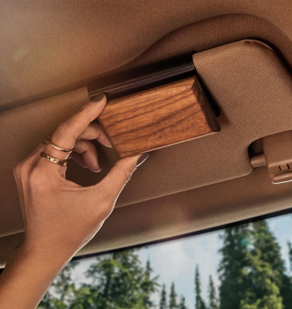 Aether cartridge being fitted to a Tesla sun visor