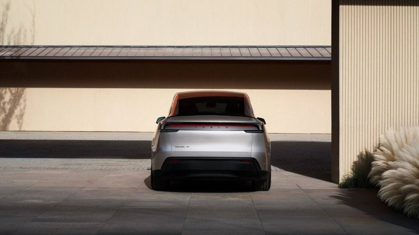 A Tesla in a landscape under a dramatic sky